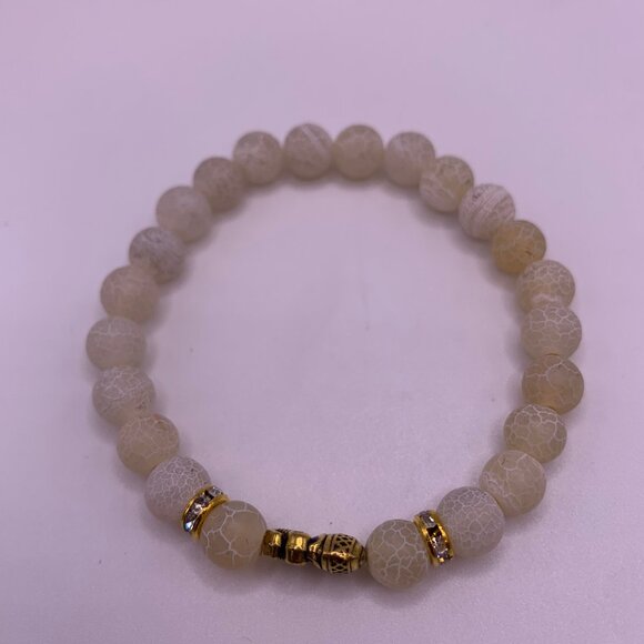 🐱 5 FOR $10.  WHITE BEAD STRETCH BRACELET W/GOLD ELEPHANT ACCENT - Picture 3 of 4
